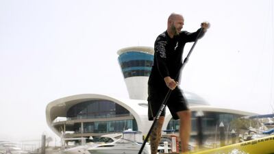 Cedric Le Rest, the general manager of Yas Marina on a stand up paddleboard (SUP) at Yas Marina in Abu Dhabi. Christopher Pike / The National