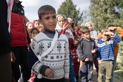 Omar Al Kouma wears a blue sling on his right arm after shrapnel hit and broke a bone in his shoulder. Matt Kynaston / The National