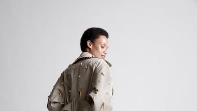 Maison Rabih Kayrouz delivered a floor-length trench coat, decorated with shells dipped in gold for haute couture autumn 2021