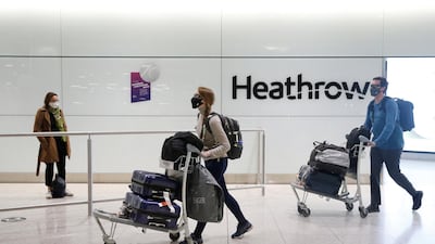 Travelers arrive at Heathrow airport in London, England. Getty Images