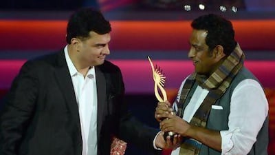 Siddharth Roy Kapoor of UTV Motion Pictures gives the award for Best Movie to the Barfi! director Anurag Basu. Indranil Mukherjee / AFP