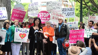 Jay Leno watches as his wife Mavis speaks as supporters of women’s rights groups protest across from the Beverly Hills Hotel. The US government has been largely silent on the issue until Tuesday, when the State Department told reporters the ambassador to Brunei had privately relayed concerns to the government there about the law. Frederic J. Brown / AFP
