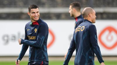 Cristiano Ronaldo, left, shares a joke with Portugal teammate Pepe. EPA