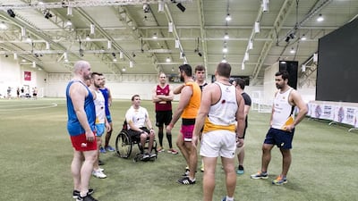 Mike Ballard, in a wheelchair, attends a training session of the team touring Madagascar this summer. Reem Mohammed / The National