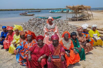 Aida Sarr, centre, with women of Maya island, whose daily lives are dedicated to fighting the rising sea levels there. Photo: Action Aid