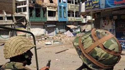 Pakistani army soldiers patrol a deserted street in Mingora, the capital of the troubled Swat valley, on May 27.
