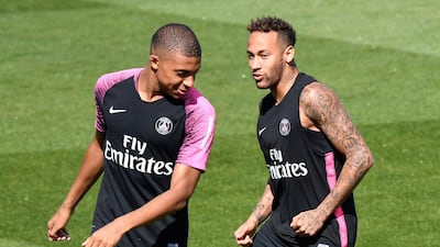 French forward Kylian Mbappe, left, and Brazilian forward Neymar take part in a training session in Saint-Germain-en-Laye. AFP