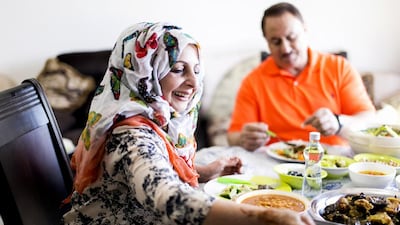 Basima Al Tamimi and her husband Aziz Al Tamimi enjoy a Iraqi meal at their home in Abu Dhabi. Reem Mohammed / The National