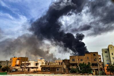 Smoke plumes billow from a fire at a warehouse in southern Khartoum amidst fighting on June 7. AFP
