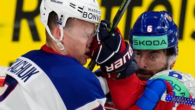 Michal Kempny punches Brady Tkachuk during a quarter-final match between the Czech Republic and the US at the Ice Hockey World Championships in Prague. AP
