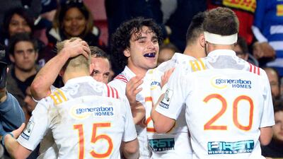 Chiefs' team players celebrate after scoring a try during the Super Rugby quarter-final rugby union match against the Stormers at Newlands Stadium in Cape Town, on July 22, 2017. Rodger Bosch / AFP