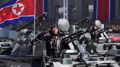 Korean People's Army (KPA) soldiers stand atop armoured vehicles during a military parade on Kim Il Sung square in Pyongyang. AFP