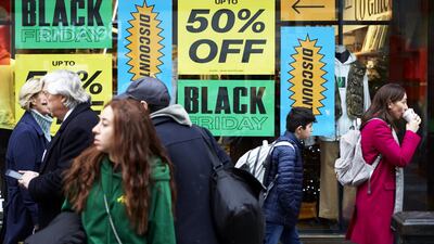 A shop front displays its Black Friday sales in Oxford Circus in London, England. Shoppers Look For Bargains On Black Friday. Getty Images