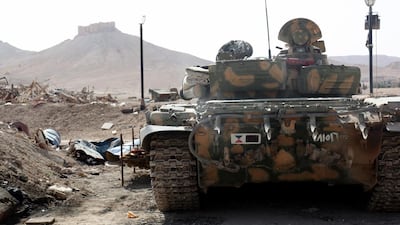 Palmyra bears scars of Syria’s continuing war: clashes between armed rebels and government forces in 2013 left collapsed columns and statues in their wake. Days before its capture, a Syrian armoured tank took up position during battles against ISIL on May 19, 2015. EPA