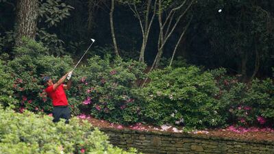 Tiger Woods hits his tee shot on the 13th hole during the final round at Augusta. Justin Lane / EPA