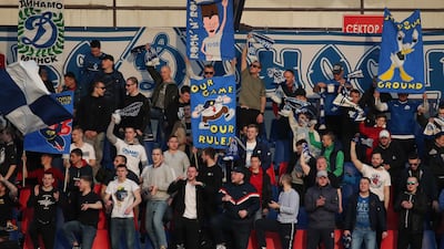 Fans cheer as they watch the match between FC Minsk and FC Dinamo-Minsk. EPA