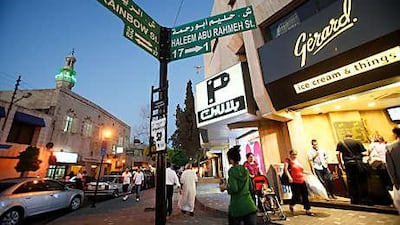 Signposts in Amman show the street names in Arabic and English as well as the numbers of buildings nearby.