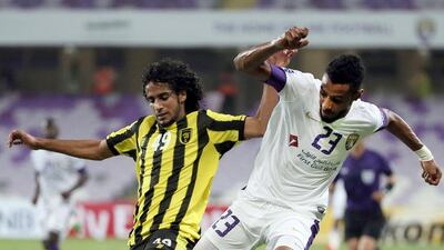 Mohamed Ahmad Gharib, right, and his Al Ain side will visit the capital on Tuesday night for an Asian Champions League match. Karim Sahib / AFP