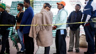 Honduran mother Nubia (C) holds her son Wilmar, 5, as they wait in line for information about applying for asylum in the US in Tijuana, Mexico. Getty