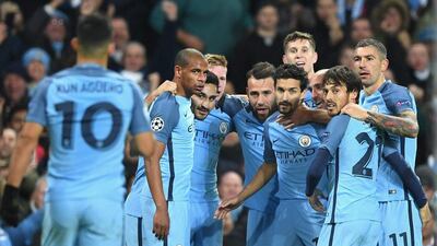 Ilkay Gundogan celebrates with teammates after scoring the goal that put Manchester City 3-1 ahead. Shaun Botterill / Getty Images