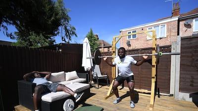 Stephens (right) and Turgott training with weights. Getty Images