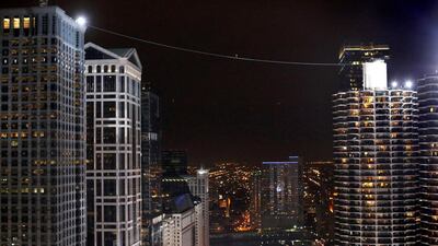 He crossed the Chicago river on a tightrope between the Marina City towers apartment buildings in Chicago, Illinois, USA. Jim Young/Reuters