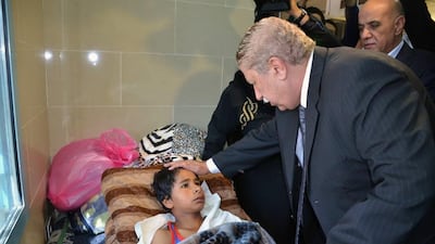 Ismailia governor Yassin Taher visits victims of the attack that targeted the Rawda mosque near El Arish, North Sinai's provincial capital. AFP