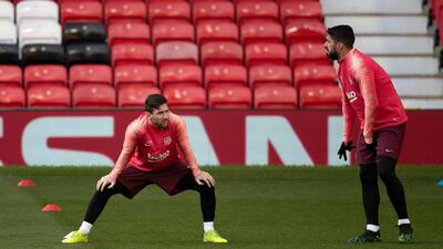 Barcelona's Lionel Messi, left, and Luis Suarez during the training session at Old Trafford, Manchester. AP