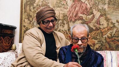 In this photo taken in December 2001, Naguib Mahfouz’s wife Attiyat-Allah gives him a flower for his birthday. Photo: Mohamed Hegazy