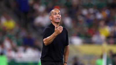 Tunisia coach Sabri Lamouchi could only watch as his players fell to a 5-1 defeat to Sweden. AFP