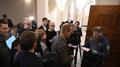 Trial observers queue in front of a courtroom of the district court where two brothers suspected of having spied on Sweden for ten years for the Russian intelligence service GRU stand trial. AFP