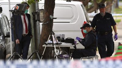 Police search for evidence at a block of flats in the Sydney suburb of Lakemba. William West.