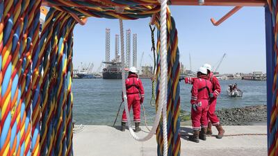 Adnoc staff during a diving at the Adnoc Logistics and Services Maritime Logistics Base in Mussafah in Abu Dhabi. Pawan Singh / The National