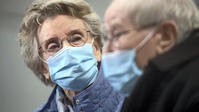 Geoff Holland, 90, and Jenny Holland, 86, are seen after receiving their injections of the Oxford/AstraZeneca vaccine in Mansfield. The couple, who met in a sheltered housing complex, were due to be married in April but had to postpone their wedding twice due to lockdown restrictions. They eventually held their ceremony in August. Reuters