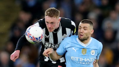 Newcastle United's Sean Longstaff challenges Manchester City's Mateo Kovacic. Reuters