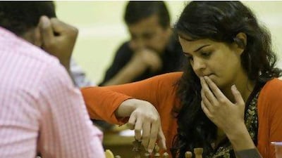 Tania Sachdev, an International Master chess player from India, makes a move against her opponent yesterday at the 13th Dubai Open Chess Championship, where $45,000 in prize money was handed out. Charles Crowell for The National