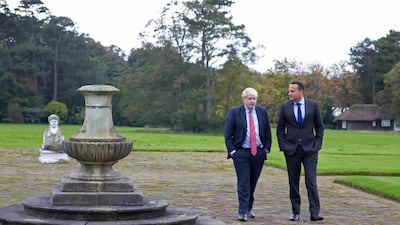Ireland's Prime Minister, Leo Varadkar and Britain's Prime Minister Boris Johnson pose for a photograph at Thornton Manor Hotel, near Birkenhead, north-west England on October 10, 2019, as they met for Brexit talks. AFP
