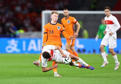 Jerdy Schouten of Netherlands sends Salih Ozcan of Turkey tumbling. EPA