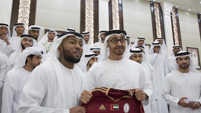 Sheikh Mohammed bin Zayed, Crown Prince of Abu Dhabi Deputy Supreme Commander of the Armed Forces, stands for a photo with members of the Al Wahdha football team winners of the Khaleej Al Arabi Cup, during an Iftar reception at Al Bateen Palace. Mohamed Al Hammadi / Crown Prince Court - Abu Dhabi