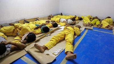 Ginco Contracting labourers rest in an air-conditioned room provided by the company. Under UAE law, employers are required to provide workers with a mandatory 2½-hour daily break to reduce health risks during the hottest summer months. Victor Besa for The National
