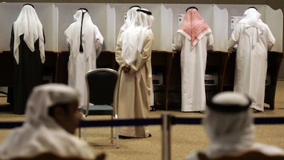 Emirati men cast their vote at a polling station in Dubai on December 18 2006. AFP