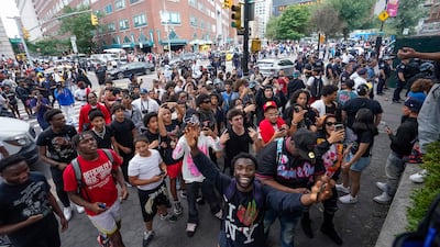 Police in New York City struggled to control a crowd of thousands of people who gathered for an internet personality's videogame console giveaway. AP