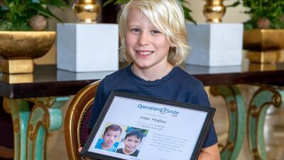 Maximilian receives an appreciation certificate from Operation Smile UAE, the organisation he helped raise the funds for.