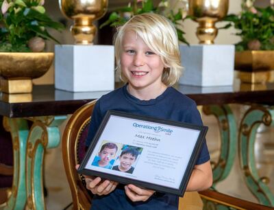 Maximilian receives an appreciation certificate from Operation Smile UAE, the organisation he helped raise the funds for. Victor Besa / The National