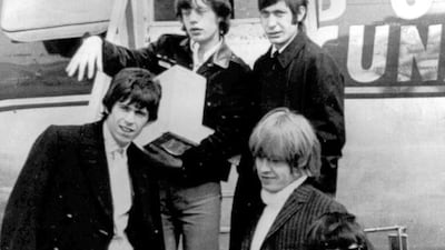 The Rolling Stones, arrive at Montreal Airport, the year their hit (I Can't Get No) Satisfaction came out. Mick Jagger, top left, Charlie Watts, top right, Keith Richards, middle left, Brian Jones, middle right, and Bill Wyman. AP