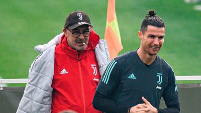 Juventus manager Maurizio behind Cristiano Ronaldo. AFP
