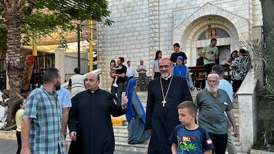 Fr Gabriel Romanelli, left, and Cardinal Pierbattista Piazzaballa, Latin Patriarch of Jerusalem, right, with parishioners. Photo: Holy Family Church Gaza
