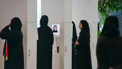 Face recognition technology set up before voters enter the voting area in Abu Dhabi. Khushnum Bhandari / The National