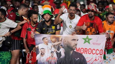 Morocco supporters cheer their team in San Pedro. AP