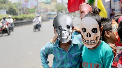 Young Indian activists wearing masks take part in an anti-tobacco campaign rally on World No Smoking Day in Calcutta, eastern India. World No Tobacco Day is marked annually on May 31 to raise awareness of the health risks of tobacco use and to push advocacy for policies to reduce tobacco consumption. Piyal Adhikary / EPA
